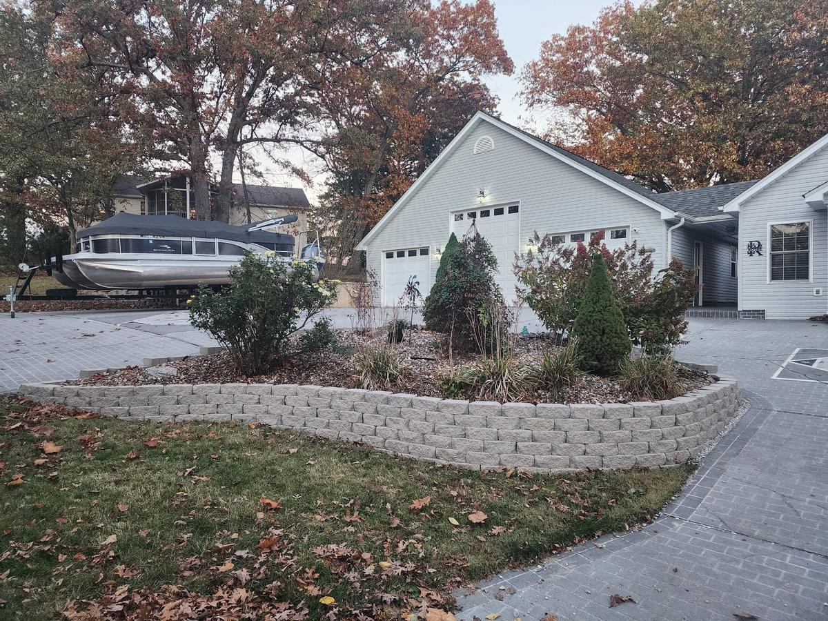 Block retaining wall along a driveway