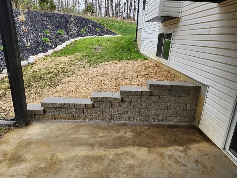 Block steps built into a retaining wall