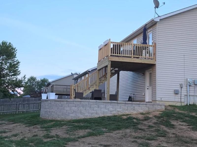 Backyard deck above a block retaining wall