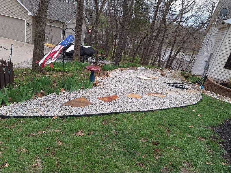 Rock landscape bed with stepping stones