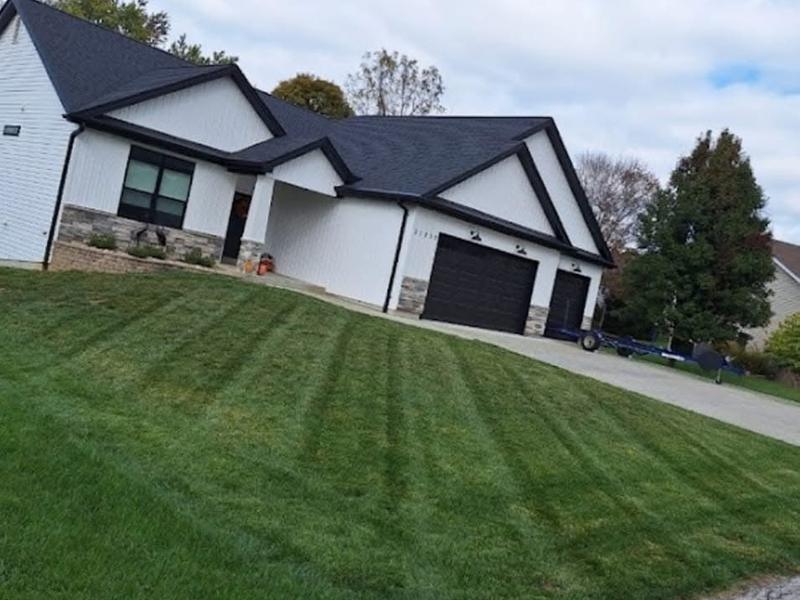 Striped front lawn after mowing